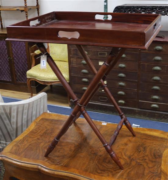 A mahogany butlers tray and stand